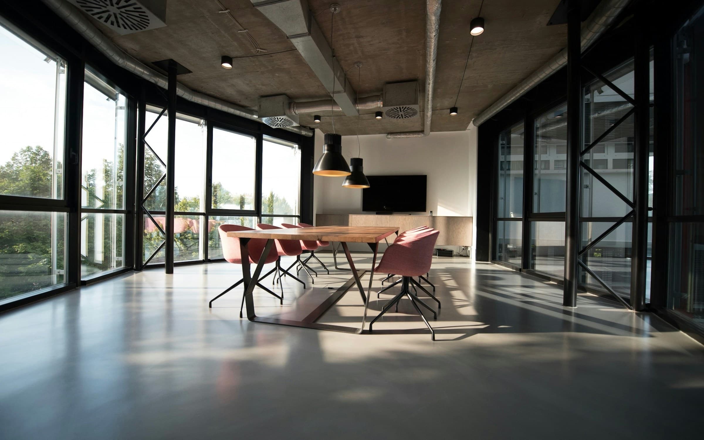 Modern professional services office with conference table and city daylight